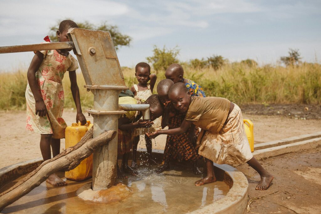 pexels-photo-28101466-28101466 Group of children gathering water from a well in Kitgum, Uganda.