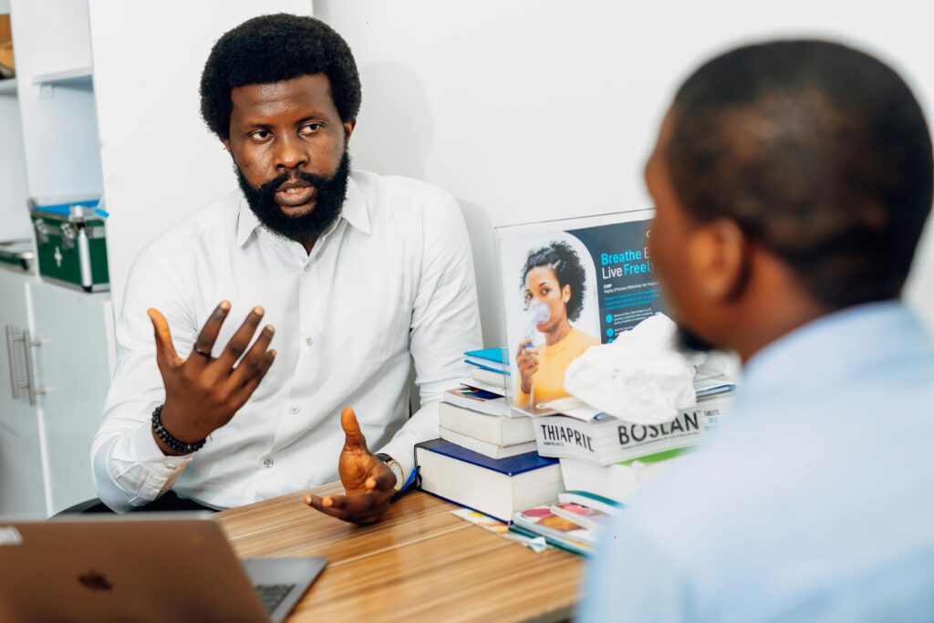 pexels-photo-30677597-30677597 A doctor discusses health concerns with a patient at a medical office in Lagos, Nigeria.
